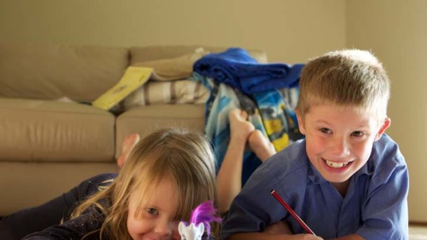 All in the timing ... Ava Corney, 4, will start school next year even though her brother Logan, 8, repeated kindergarten.