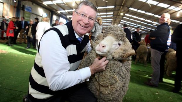 Jolly jumbucks: Premier Denis Napthine, in his woollen Geelong jumper, at Sheepvention in Hamilton last week.