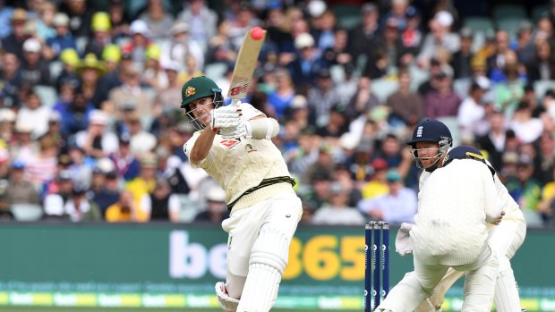 Can bat, too: Pat Cummins takes on the English attack.