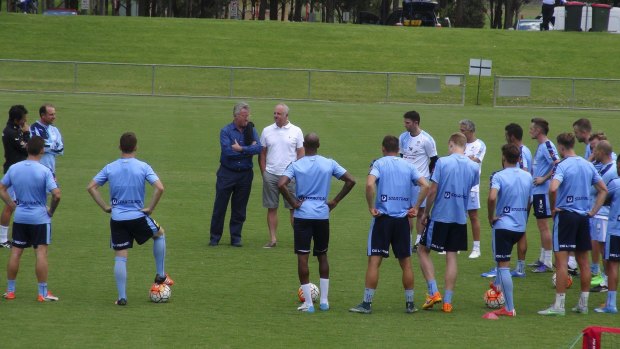 Welcome visit: Guus Hiddink chats with Graham Arnold at Sydney FC training on Monday.