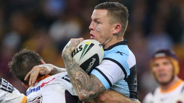 Drama-plagued career: Todd Carney is tackled by Ben Hunt of the Broncos on Friday night.