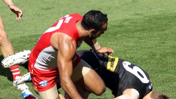 Playing hard ... Adam Goodes.