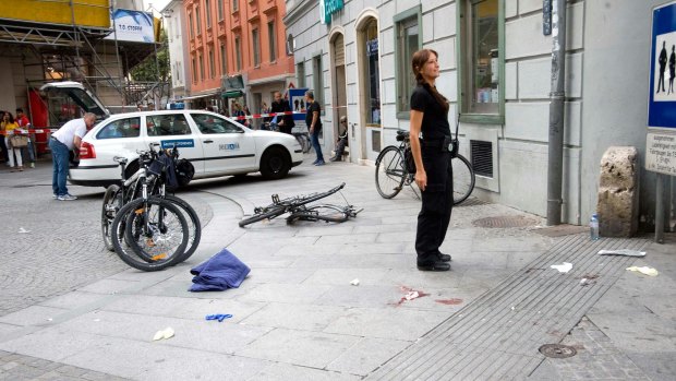 Blood and a damaged bicycle at the site of the incident.