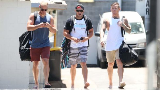Uncertain times: Cronulla's Daniel Holdsworth, Wade Graham and Todd Carney leave training at Remondis Stadium on Tuesday.