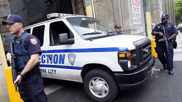 Heavily armed corrections officers stand guard as a Dominique Strauss-Kahn arrives at Manhattan Criminal Court.