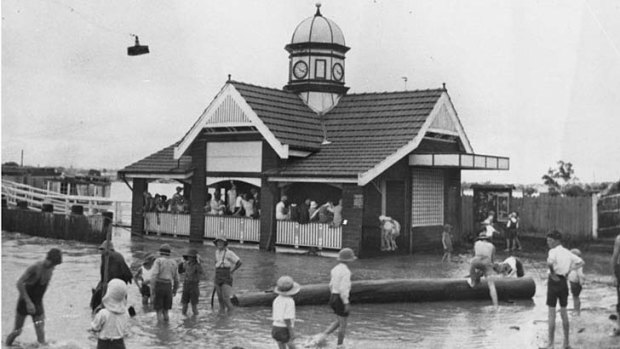 An undated photo shows children playing in the water next to the Oxford Street ferry terminal in Bulimba.