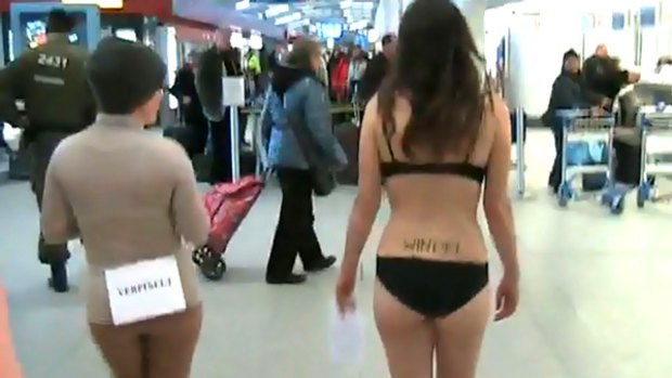 The protesters wrote slogans on their bodies to voice their concerns over airport body scanners.