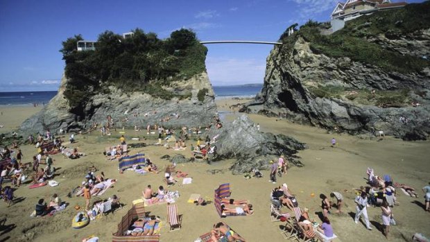 A supension bridge leads to the island at Newquay.