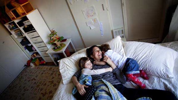 Amy Maughan with her daughters Nikita, 3, left, and Prairie, 2, in their one-bedroom apartment. ‘‘The stress is always there, knowing you’re drifting further into poverty.’’