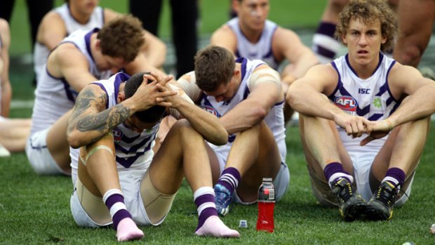Dejected... The Fremantle Dockers moments after the last siren for the 2013 AFL Grand Final.