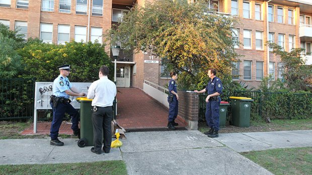 Police say they are speaking to neighbours of the apartment where the woman fell and died.