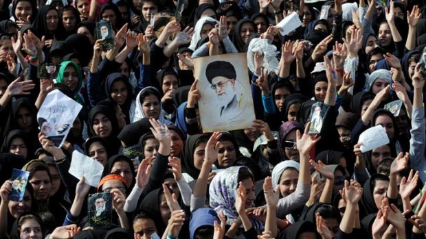 A crowd listens to Iran's Supreme Leader Ayatollah Ali Khamenei in the province of Kermanshah, west of Tehran.