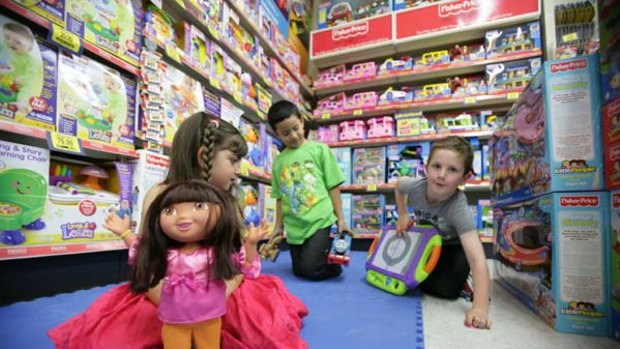 Telling it like it is  ... Brianna Farrugia, left, Eli Boaza and Alasdair Hando put their toys to the test.  Many parents want to go back to traditional gifts.