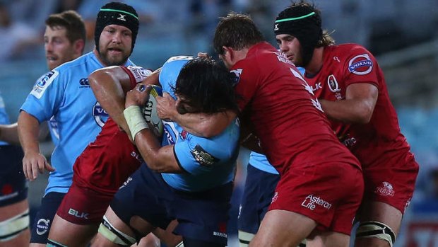 "I just go hard at whatever I do,'' says Waratahs second-rower Jacques Potgieter, pictured mixing it with the Reds last Saturday night.