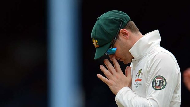 Backing Brad Haddin ... Australia's Michael Clarke agonises over a dropped catch