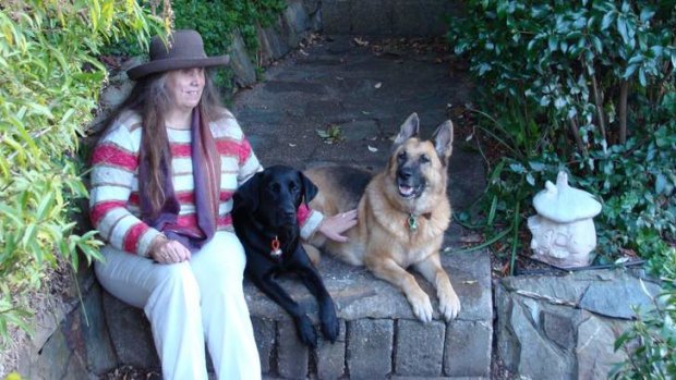 Best friends ... Elaine Harris with Rosi and Allie in her Burnie garden.