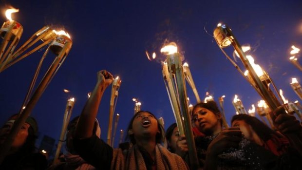 People take part in a torch-lit rally as they celebrate after the Supreme Court rejected Abdul Quader Mollah's request for an appeal against his death sentence in Dhaka.
