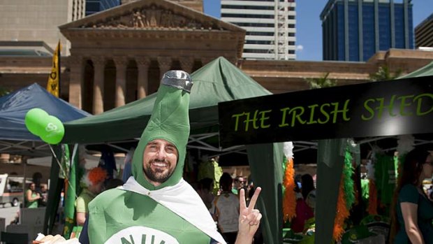 A human beer Bottle at the Irish fair held in King George square after the finish of the st Patrick's Day Parade