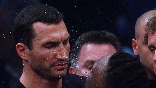 British boxer Dereck Chisora spits water in the face of Wladimir Klitschko.