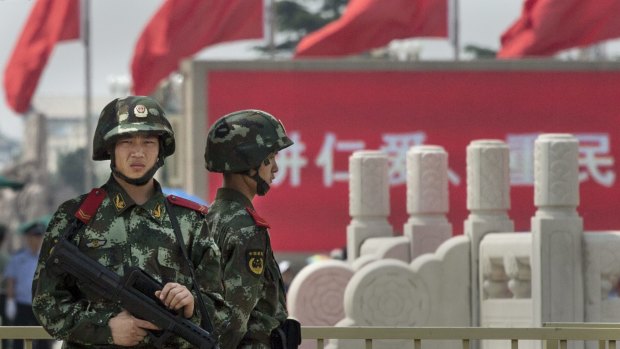 Chinese Paramilitary police stand guard in Tiananmen Square. Authorities are bracing for a potential protest in support of Hong Kong's student demonstrations.