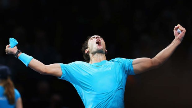 Rafael Nadal celebrates beating Stanislas Wawrinka to win the ATP finals.