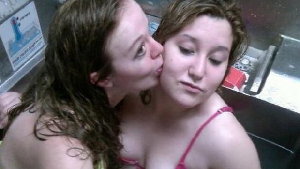 Busted ... These Californian KFC workers were fired for publishing these shots of them bathing in a KFC basin on MySpace.