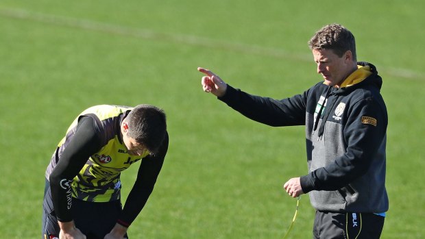New direction? Coach Hardwick and skipper Trent Cotchin at training this week as Richmond rebel Leon Davies demanded "brave" club leadership.