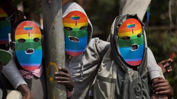 Solidarity movement: Kenyan gays and lesbians wear masks to preserve their anonymity as they stage a rare protest, against Uganda's increasingly tough stance against homosexuality.