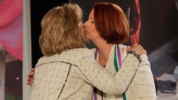 Mutual respect ... US Secretary of State Hillary Clinton, left, kisses Australia Prime Minister Julia Gillard.
