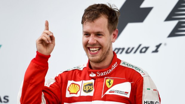 Sebastian Vettel on the podium after winning the Malaysia Grand Prix at Sepang Circuit on Sunday.