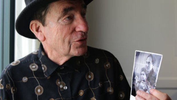 How times change ... Albie Sachs holds a photograph of him with his young son, Oliver.