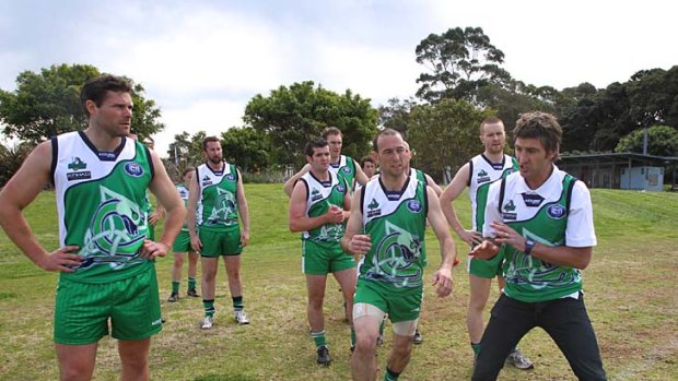 Sydney Swans player Brett Kirk offers training tips to the Ireland AFL team playing in Sydney for the AFL International Cup.