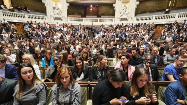 Members of the audience are pictured prior to the start of the French President's speech at the Sorbonne.
