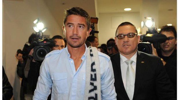 Media pressure ... Harry Kewell arrives at Melbourne Airport.