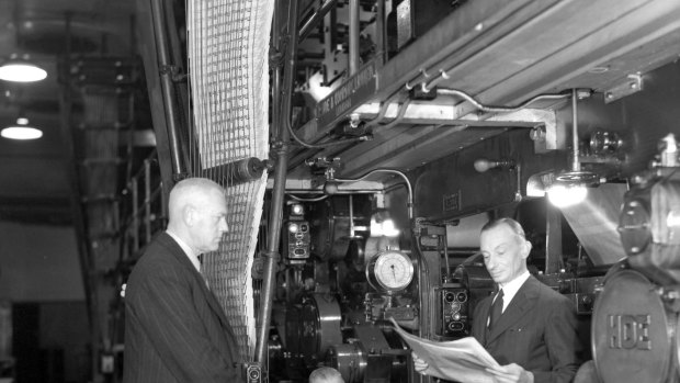 Messrs Denne, Turner and Luft look at the newspapers as they come off the hot press 9th August 1944.