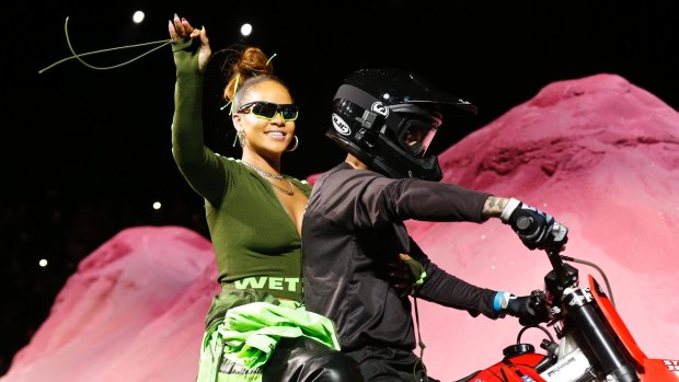 Rihanna rides on a motorcycle after showing her fashion collection from Fenty Puma by Rihanna during Fashion Week, Sunday, Sept. 10, 2017, in New York. (AP Photo/Bebeto Matthews)