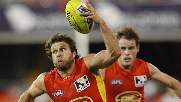 Campbell Brown of the Gold Coast Suns controls the ball during the clash against the Fremantle Dockers at Metricon Stadium.