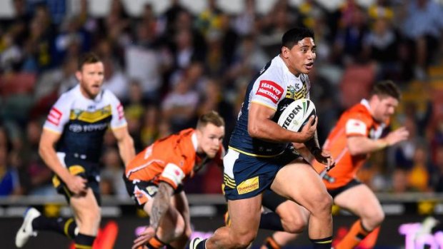 Outclassed: Jason Taumalolo outpaces Wests Tigers players en route to a try for the Cowboys.