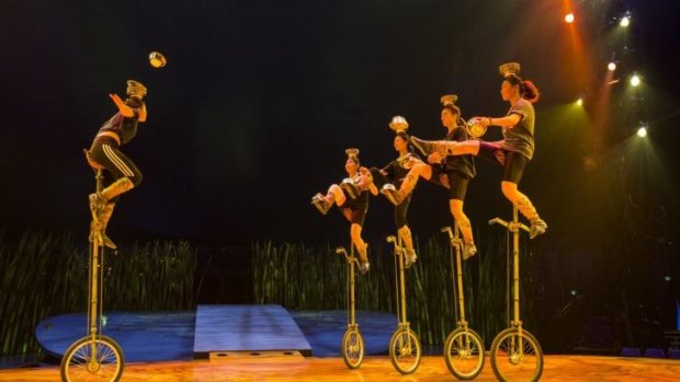 Balance: A troupe of Mongolian girls performing with metal bowls on top of two-metre-high unicycles.
