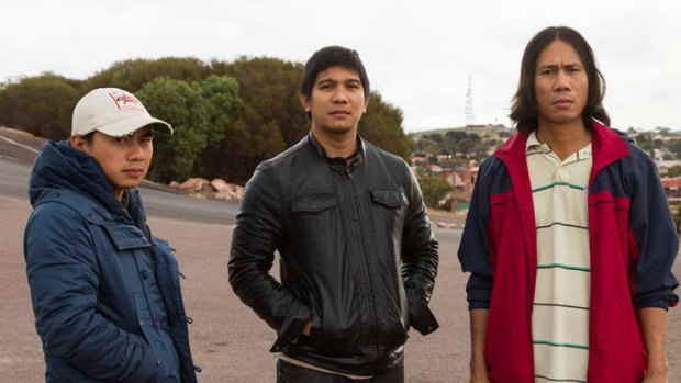 Anthony Naupan, flanked by Roland Dicang (left) and Arnold Tabilon in Whyalla, was shocked by costs attached to a work visa.
