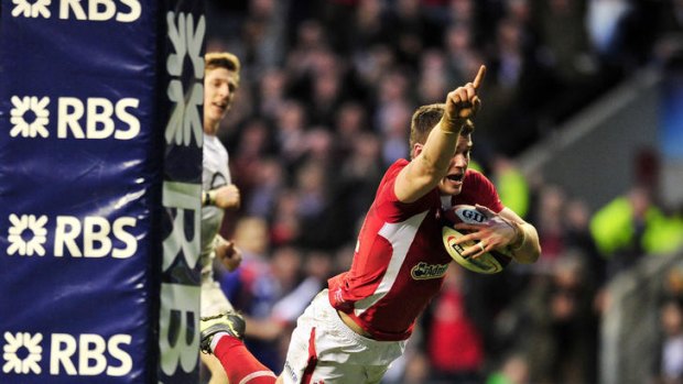 Crown clincher ... Scott Williams scores the match-winning try for Wales.