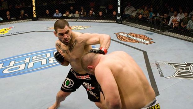 Brutal ... UFC heavyweight champion Cain Velasquez dishes out some punishment in one of his UFC bouts.