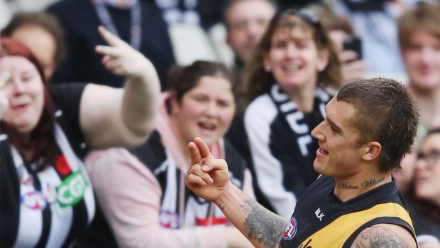 Dustin Martin gives a two-fingered salute to the crowd during the weekend's match against Collingwood.