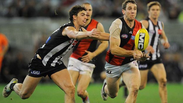 Collingwood's Scott Pendlebury chases Essendon's Kyle Hardingham on Sunday - but only those with pay TV could see the game.
