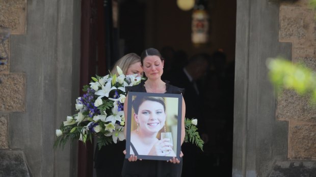 Mourners leave the Beechworth church where Andrea Lehane was farewelled, and where she married her husband, James, five years earlier.