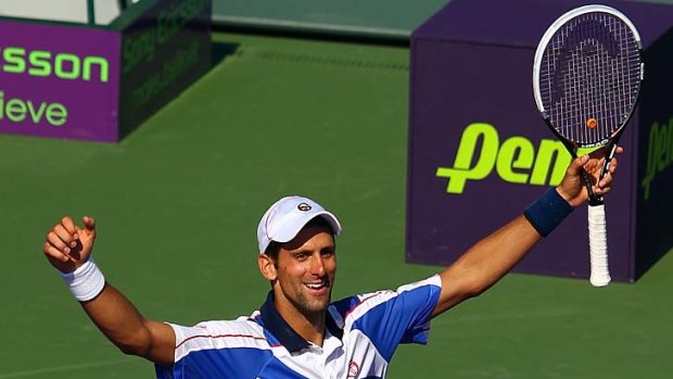 Novak Djokovic celebrates after defeating Rafael Nadal.