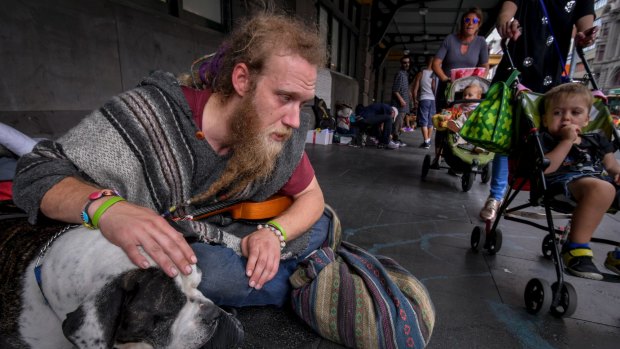 Glen, 32, with his dog, Tonka, at the Flinders Street Station camp.