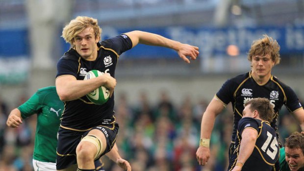 Richie Gray breaks a tackle from Ireland's Tommy Bowe to score Scotland's only try.