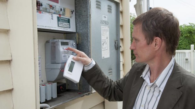 Richard Keech with his smart meter at his Essendon home in Melbourne.