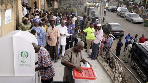 Nigerians vote for a second day in Lagos, Nigeria, on Sunday.